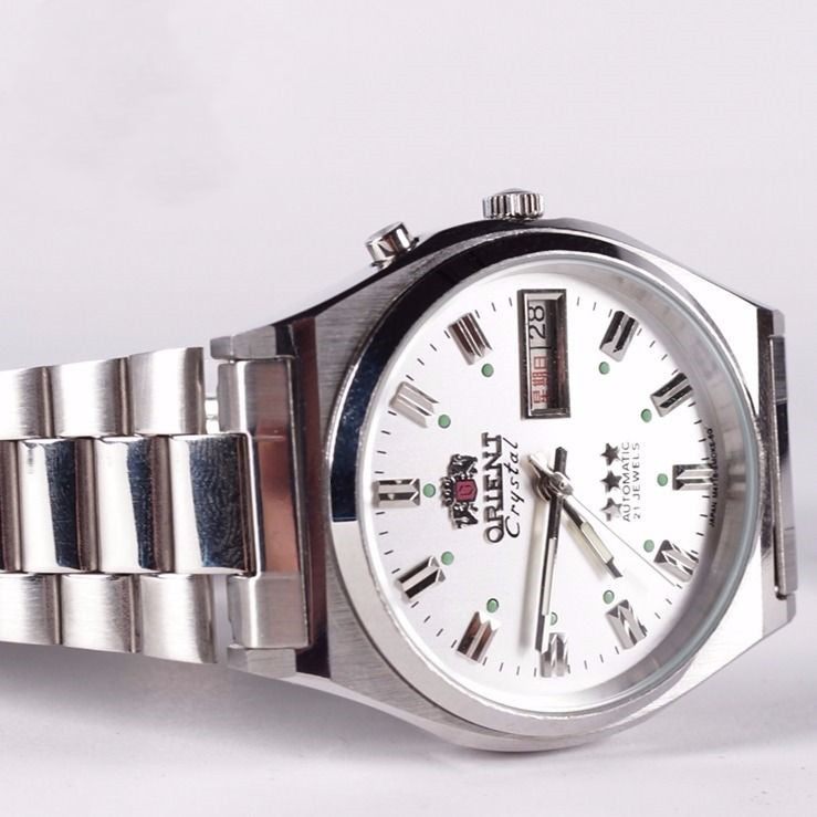White dial Orient Crystal 3 Star automatic watch on a stainless steel bracelet