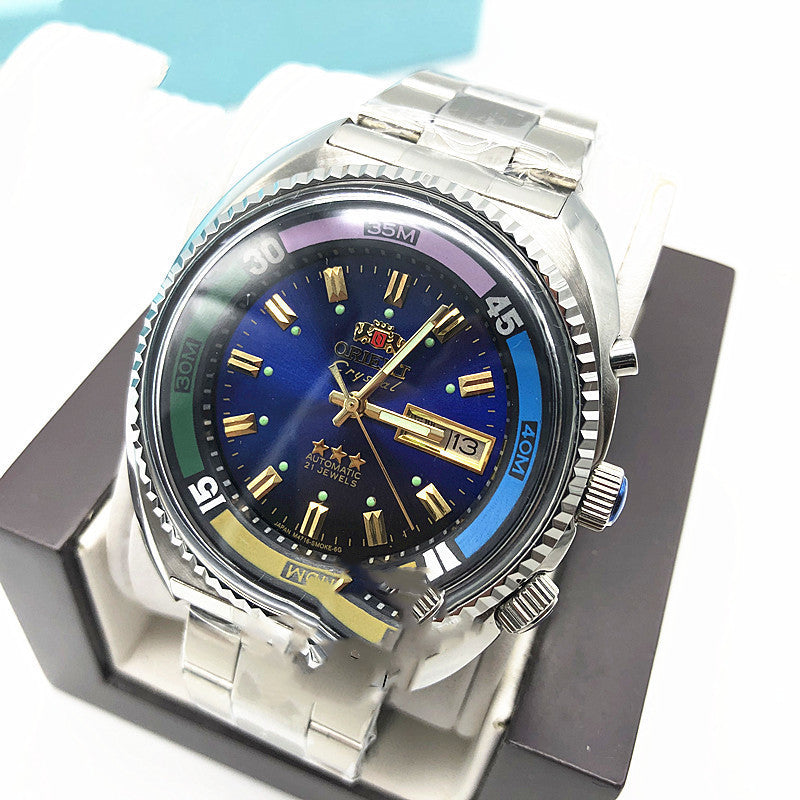 Blue and gold dial Orient Crystal automatic diver with day and date window, shown in its box