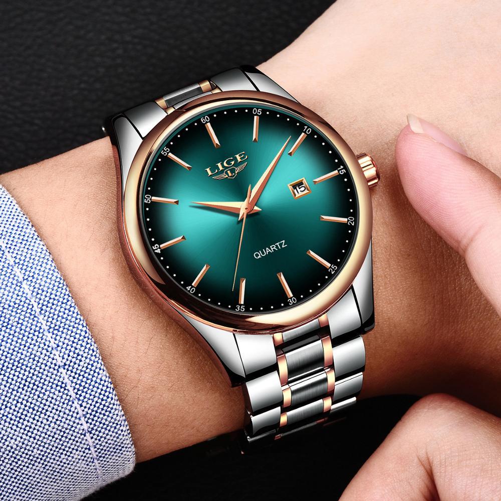 Green dial LIGE watch worn on a wrist below a blue shirt cuff