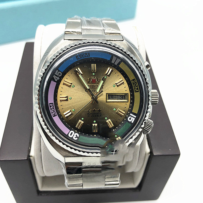Tea brown dial Orient Crystal automatic diver with luminous markers and a rainbow bezel