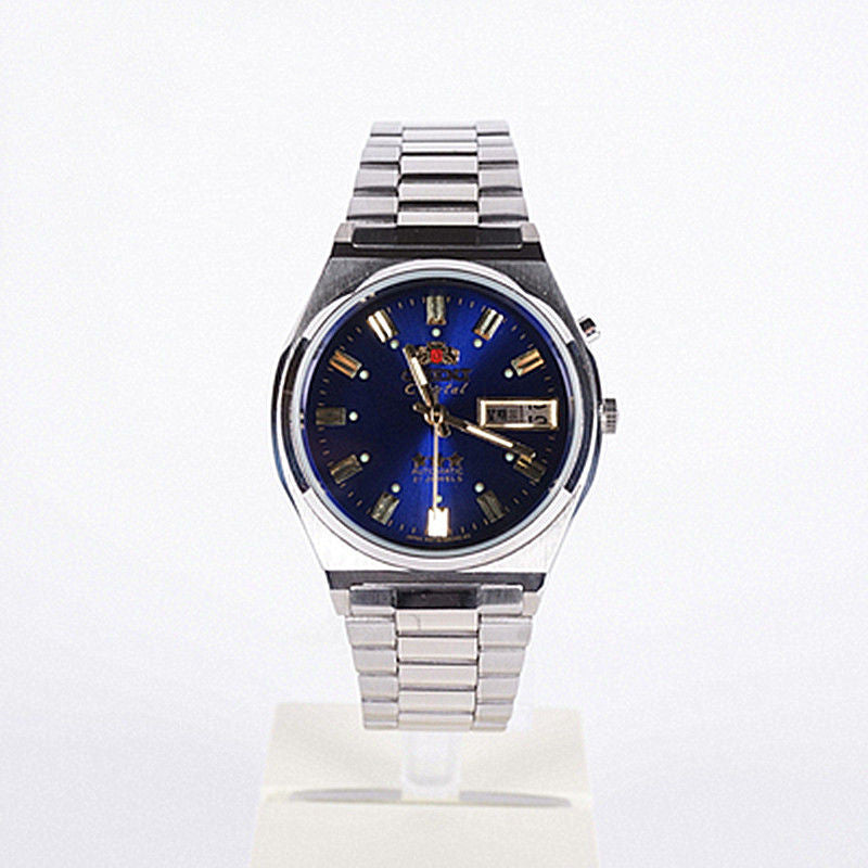 Blue dial Orient Crystal 3 Star automatic watch standing on a display block