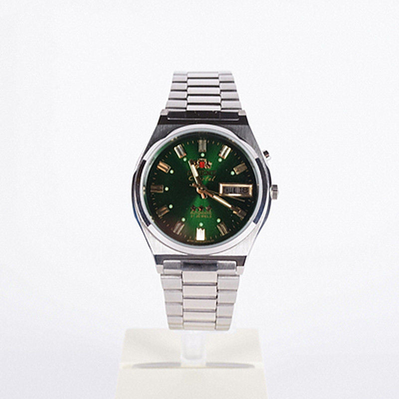 Green dial Orient Crystal 3 Star automatic watch with gold hands and applied markers