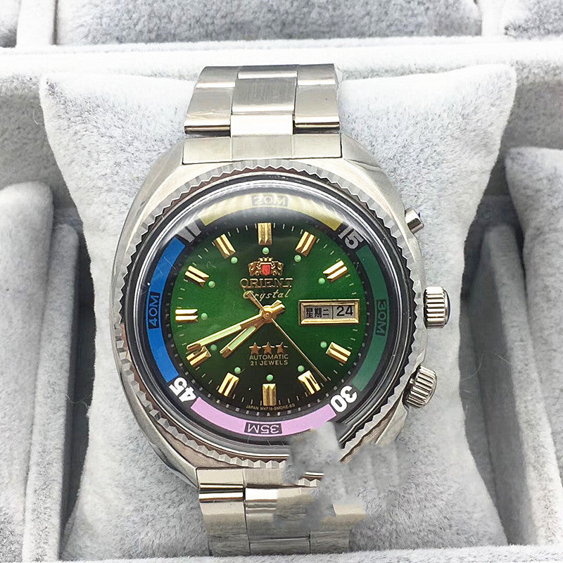 Green dial Orient Crystal automatic diver with a rainbow bezel ring in its box